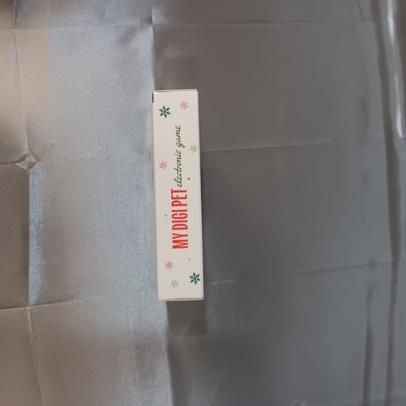 Digi Pet Electronic Digital Pet Keychain Game Red Over 100 Pets NEW SEALED 2024 - Picture 5 of 6